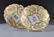 245: A PAIR OF MEISSEN PARCEL GILT AND MOLDED DISPLAY B