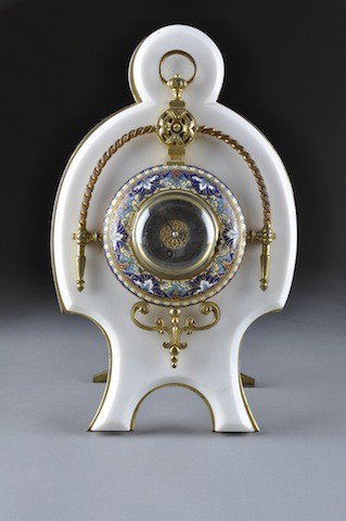 AN ANTIQUE FRENCH GILT BRONZE AND CHAMPLEVÉ ENAMEL: AN ANTIQUE FRENCH GILT BRONZE AND CHAMPLEVÉ ENAMEL MOUNTED WHITE MARBLE DESK CLOCK, FOURTH-QUARTER 19TH CENTURY, the glazed circular hinged bezel enclosing a silvered dial with black Roman chapters a