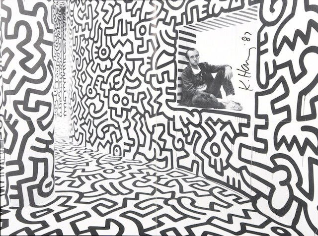 KEITH HARING (American 1958-1990) A SIGNED BLACK: KEITH HARING (American 1958-1990) A SIGNED BLACK AND WHITE LITHOGRAPH of the artist and three-dimensional walls, signed with black felt tip "K. Haring '87." Haring has become one of the most popular a