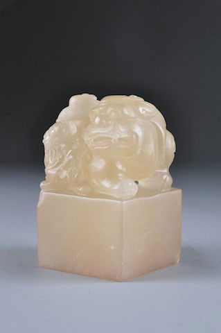 AN UNUSUALLY LARGE CHINESE CARVED SOAPSTONE SEAL,: AN UNUSUALLY LARGE CHINESE CARVED SOAPSTONE SEAL, of square form and modeled as a snarling Buddhistic lioness and her cub with scrolling tails and fierce facial details on an incorporated block pedest