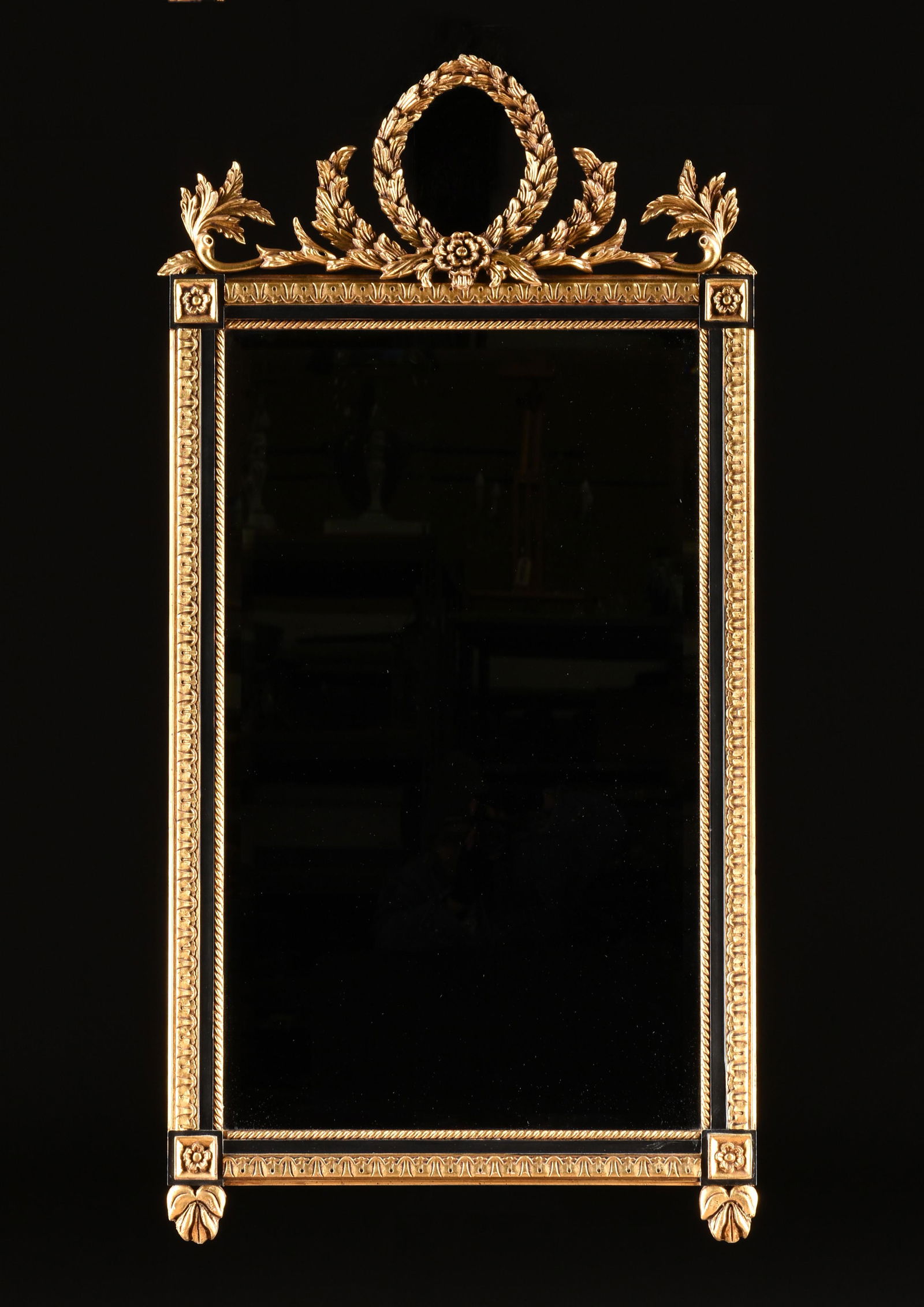 AN ITALIAN NEOCLASSICAL STYLE PARCEL GILT AND BLACK PAINTED WOOD MIRROR, STAMPED, LATE 20TH CENTURY, (1 of 3)