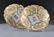 138: A PAIR OF MEISSEN PARCEL GILT AND MOLDED DISPLAY B