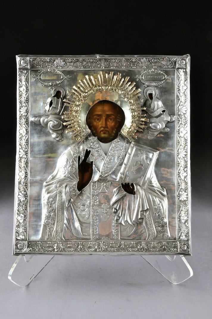 A RUSSIAN SILVER GILT ON SILVER OKLAD MOUNTED ICON: A RUSSIAN SILVER GILT ON SILVER OKLAD MOUNTED ICON OF ST. NICHOLAS OF MYRA, MAKER'S AND ASSAYER'S STAMPS, CITY OF KAZAN, 1837, of rectangular form and enclosing a complete polychrome painted three-qua