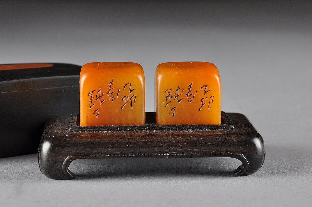 A PAIR OF VINTAGE TIANHUANG STONE CUBE SEALS, 20TH: A PAIR OF VINTAGE TIANHUANG STONE CUBE SEALS, 20TH CENTURY, each of square form with one side enclosing incised character marks above a square character seal marks on underside, on a rectangular carve