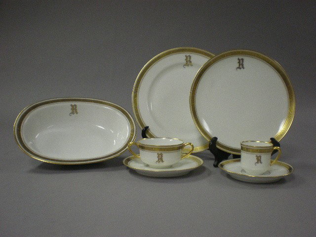 A HAVILAND PICKARD DINNER SERVICE: A HAVILAND PICKARD DINNER SERVICE comprising 10 dinner plates, 10 salad plates, 10 bread and butter plates, 10 demitasse cups and saucers, 9 bouillon cups and saucers, and 2 serving bowls. (51 pieces)