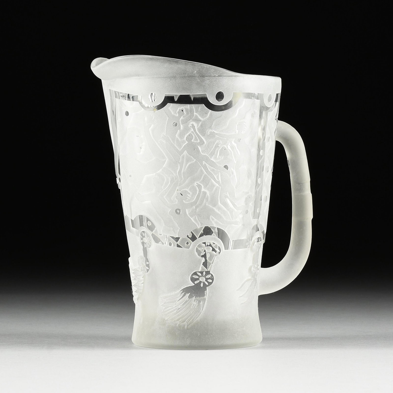 PATRICK WADLEY (American/Texas 1950-1992) AN EROTIC ART GLASS PITCHER, SIGNED, 1984,: PATRICK WADLEY (American/Texas 1950-1992) AN EROTIC ART GLASS PITCHER, SIGNED, 1984, harlequin motifs and layered nude figures presented in clear cut and frosted etched glass, etched signed, "P. Wadla