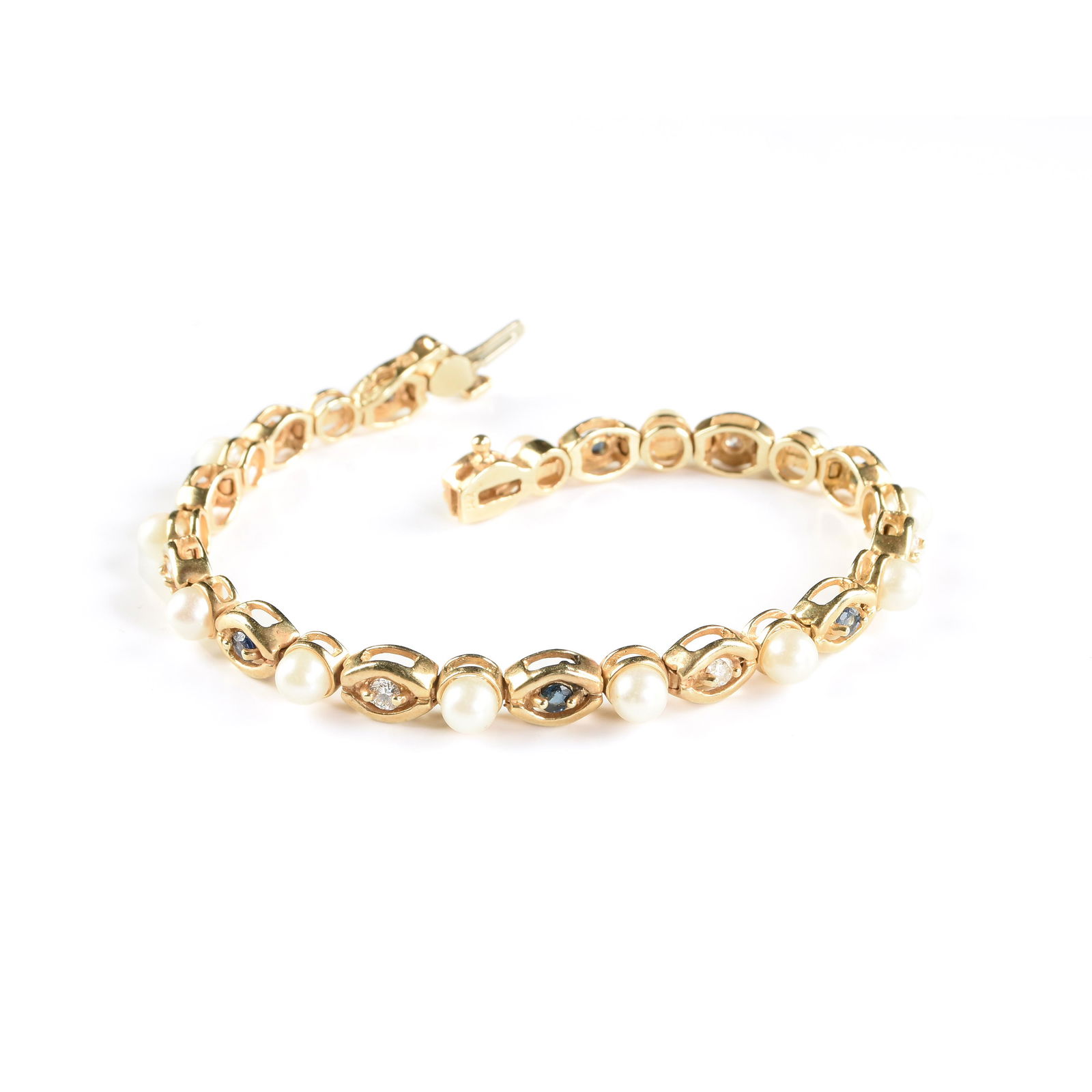 A 14K YELLOW GOLD, SAPPHIRE, DIAMOND, AND PEARL BRACELET, 1970s, (1 of 1)