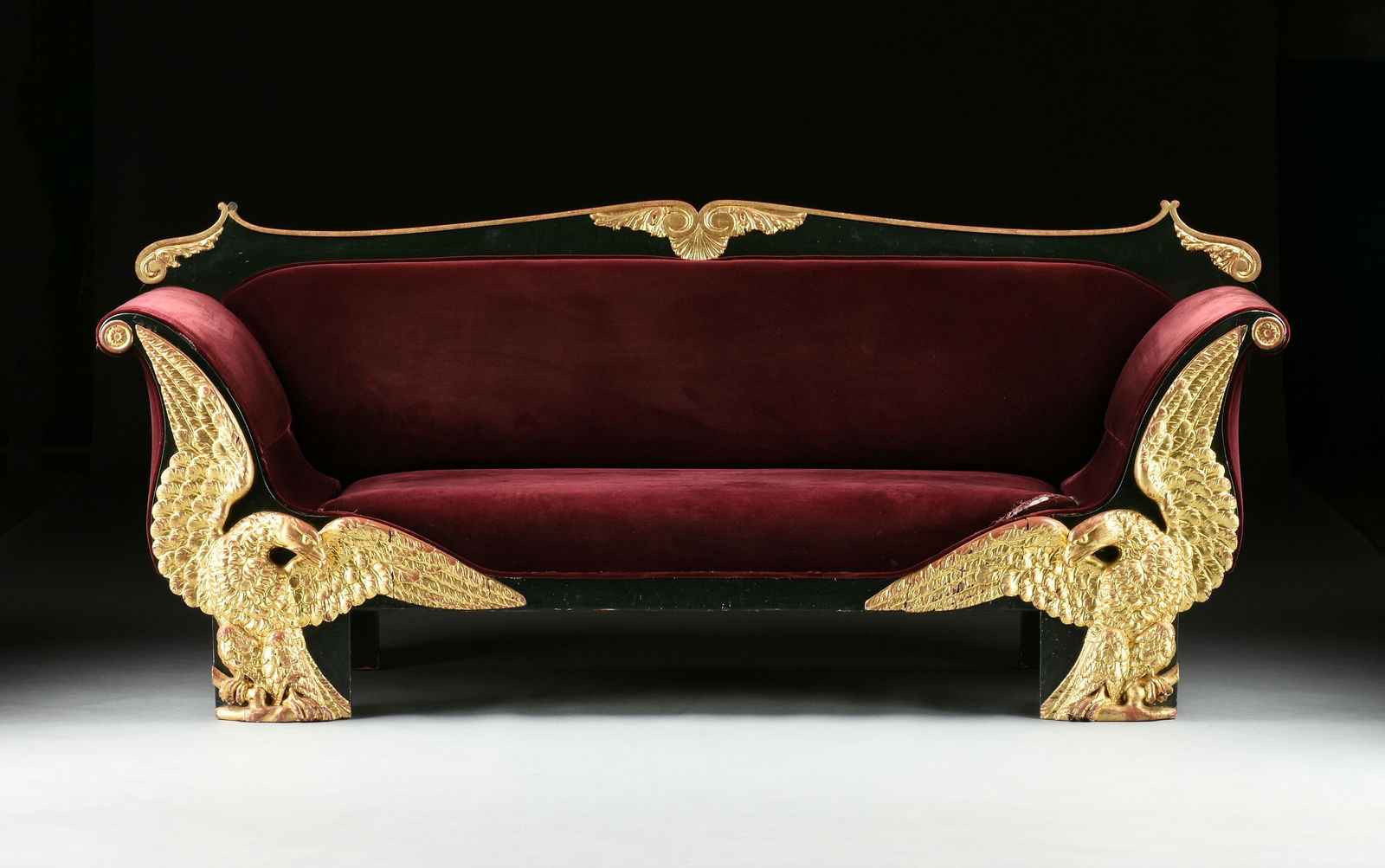 A RUSSIAN EMPIRE PARCEL GILT GREEN LACQUERED EAGLE LEG SETTEE, EARLY 19TH CENTURY, (1 of 9)