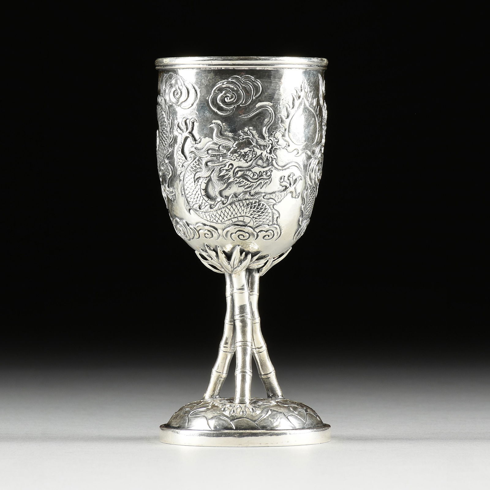 A QING DYNASTY CHINESE EXPORT SILVER "BAMBOO AND DRAGONS IN PURSUIT" GOBLET, ATTRIBUTED TO CUMWO, HO (1 of 8)