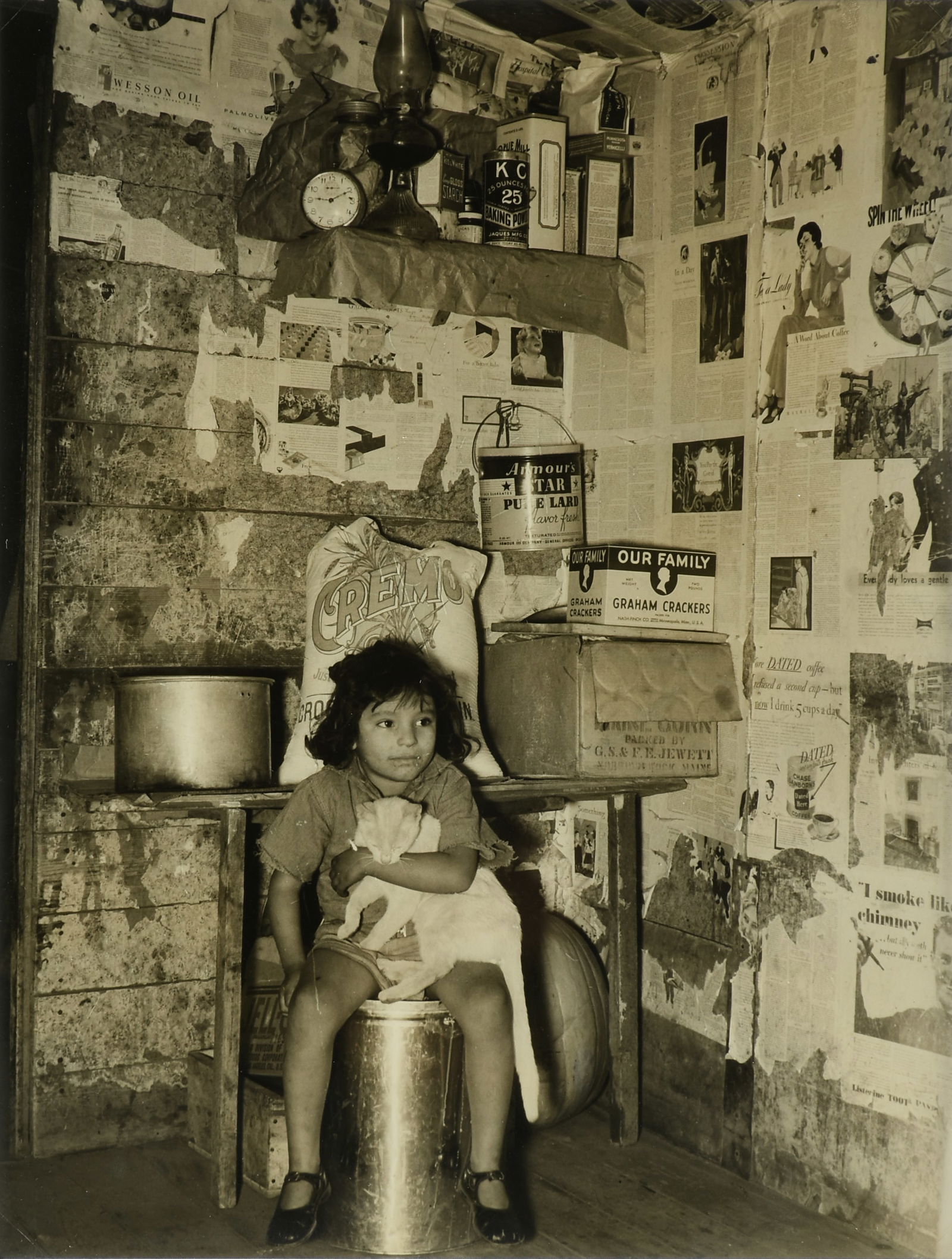 RUSSELL LEE (American/Texas 1903-1986) TWO PHOTOGRAPHS, "Girl Holding Her Cat" and "Girl Brushing (1 of 12)