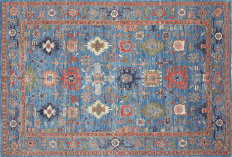 A PERSIAN HERIZ WOOL RUG, PAKISTAN, 20TH CENTURY,: A PERSIAN HERIZ WOOL RUG, PAKISTAN, 20TH CENTURY, blue ground with olive green and rust color vegetal scrolls, 100% wool pile; approximately 108" x 72". 9ft. 2in. x 6ft. 2in.