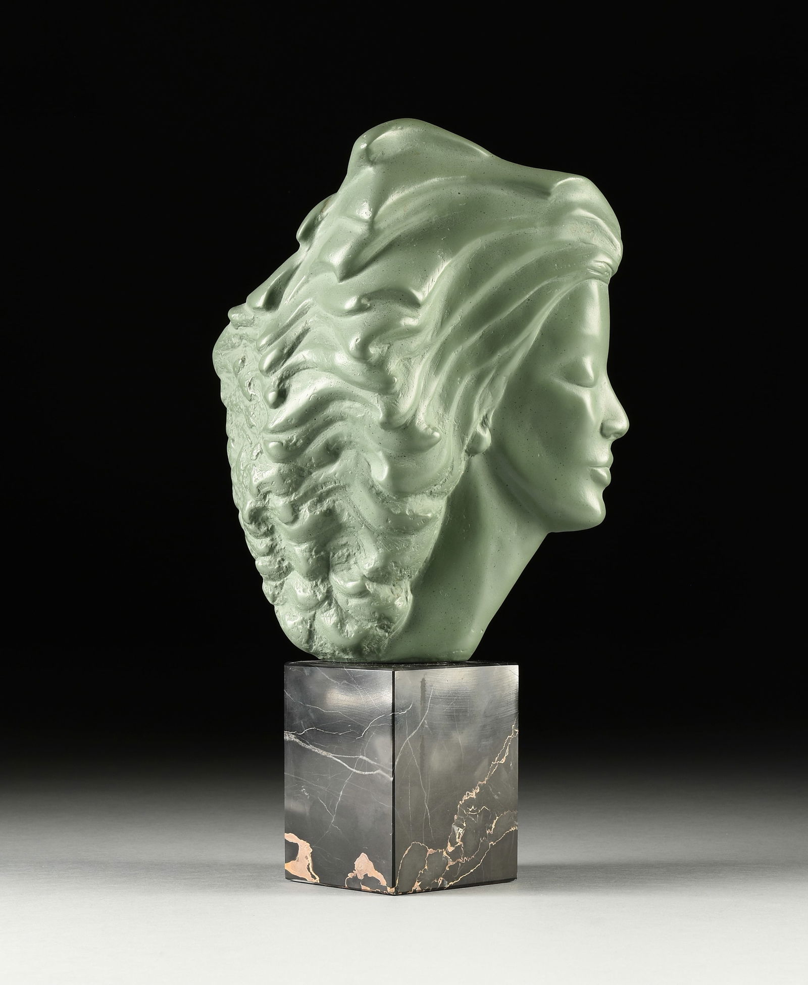 PEGGY MACH (American 1922-2013) A SCULPTURE, "Head of a Woman," 1971,: PEGGY MACH (American 1922-2013) A SCULPTURE, "Head of a Woman," 1971, green patinated composite material on a black marble stand, signed and dated at base, "PEGGY MACH © 1971" and marked "AMR," a