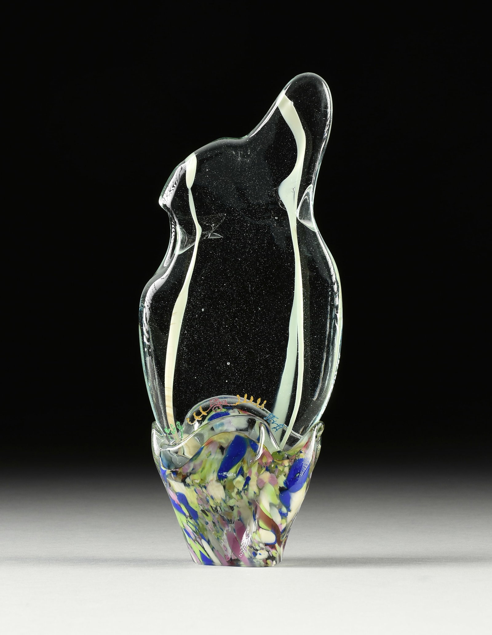 GENE KOSS (American/Louisiana b. 1947) A GLASS SCULPTURE, "Ridge Climb," 1985,: GENE KOSS (American/Louisiana b. 1947) A GLASS SCULPTURE, "Ridge Climb," 1985, colored and clear glass with paint and engraving, signed, dated and titled at right, on a sand blasted foot. Height: 11" 