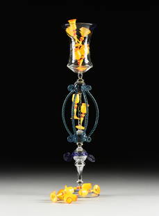 AMERICAN PILCHUCK GLASS SCHOOL, AN ART GLASS SCULPTURE, "Tumbling Yellow Glasses Goblet," SIGNED,: AMERICAN PILCHUCK GLASS SCHOOL, AN ART GLASS SCULPTURE, "Tumbling Yellow Glasses Goblet," SIGNED, WASHINGTON, 1995, clear, cobalt, teal, opaque yellow, and orange glass goblet form centerpiece, foot