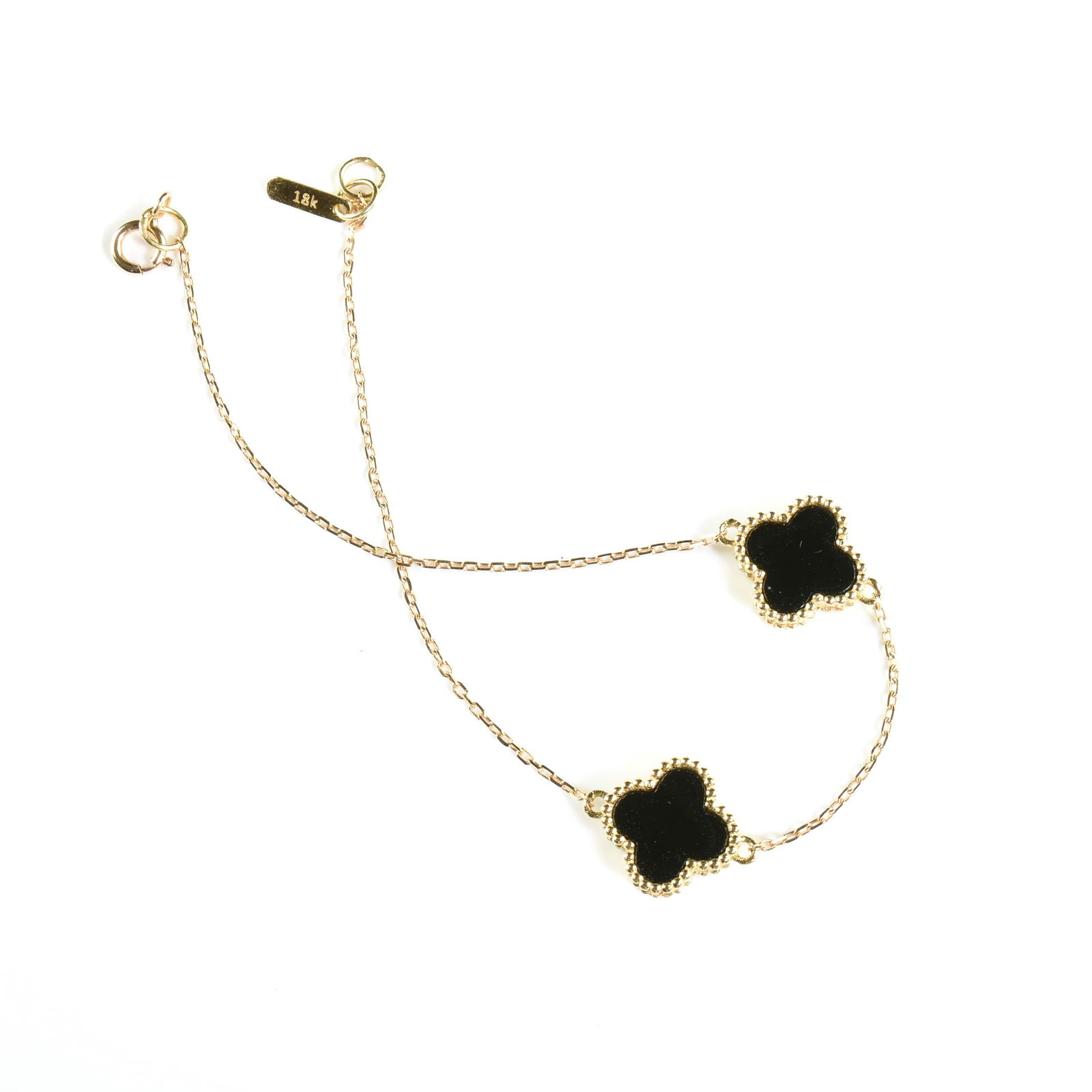TWO "ALHAMBRA" STYLE 18K YELLOW GOLD, BLACK ONYX, AND MOTHER-OF-PEARL QUATREFOIL BRACELETS, AFTER (1 of 4)