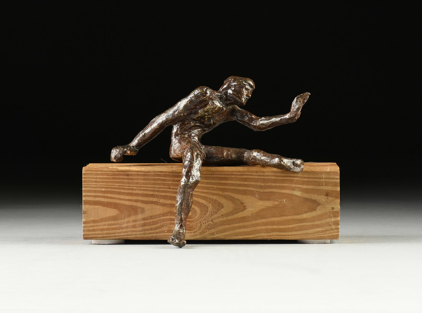 VICTOR SALMONES (Mexican 1937-1989) A SCULPTURE, "Nude Seated Man," 1960s,: VICTOR SALMONES (Mexican 1937-1989) A SCULPTURE, "Nude Seated Man," 1960s, cast bronze on wood, signed in sgraffito in bronze below thigh, "Victor Salmones." Height: 8 1/2" Width: 9" Depth: 4 3/4"