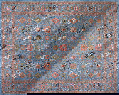 A PERSIAN HERIZ ROOM SIZE WOOL RUG, PAKISTAN, 20TH CENTURY,: A PERSIAN HERIZ ROOM SIZE WOOL RUG, PAKISTAN, 20TH CENTURY, blue ground with rouge, olive, and rust vegetal scrolls, 100% wool pile, labeled; approximately 12' x 14'.