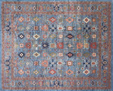 A PERSIAN HERIZ ROOM SIZE WOOL RUG, PAKISTAN, 20TH CENTURY,: A PERSIAN HERIZ ROOM SIZE WOOL RUG, PAKISTAN, 20TH CENTURY, blue ground with rouge, olive, and rust vegetal scrolls, 100% wool pile, labeled; approximately 12' x 14'.