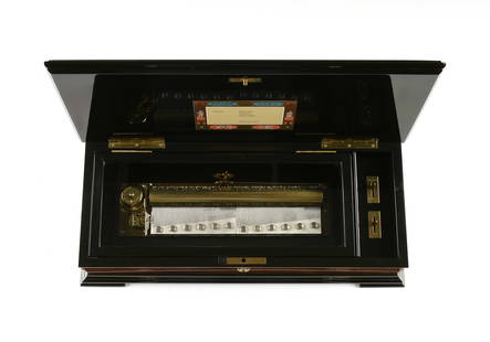 A SWISS REUGE MUSIC BOX, CHOPIN SELECTIONS, MID 20TH CENTURY,: A SWISS REUGE MUSIC BOX, CHOPIN SELECTIONS, MID 20TH CENTURY, comb cylinder, marked with no. 3605, songs include Polonaise, Tristesse, and Impromptu, lid with vintage label. Height: 4 1/4" Width: 16 1