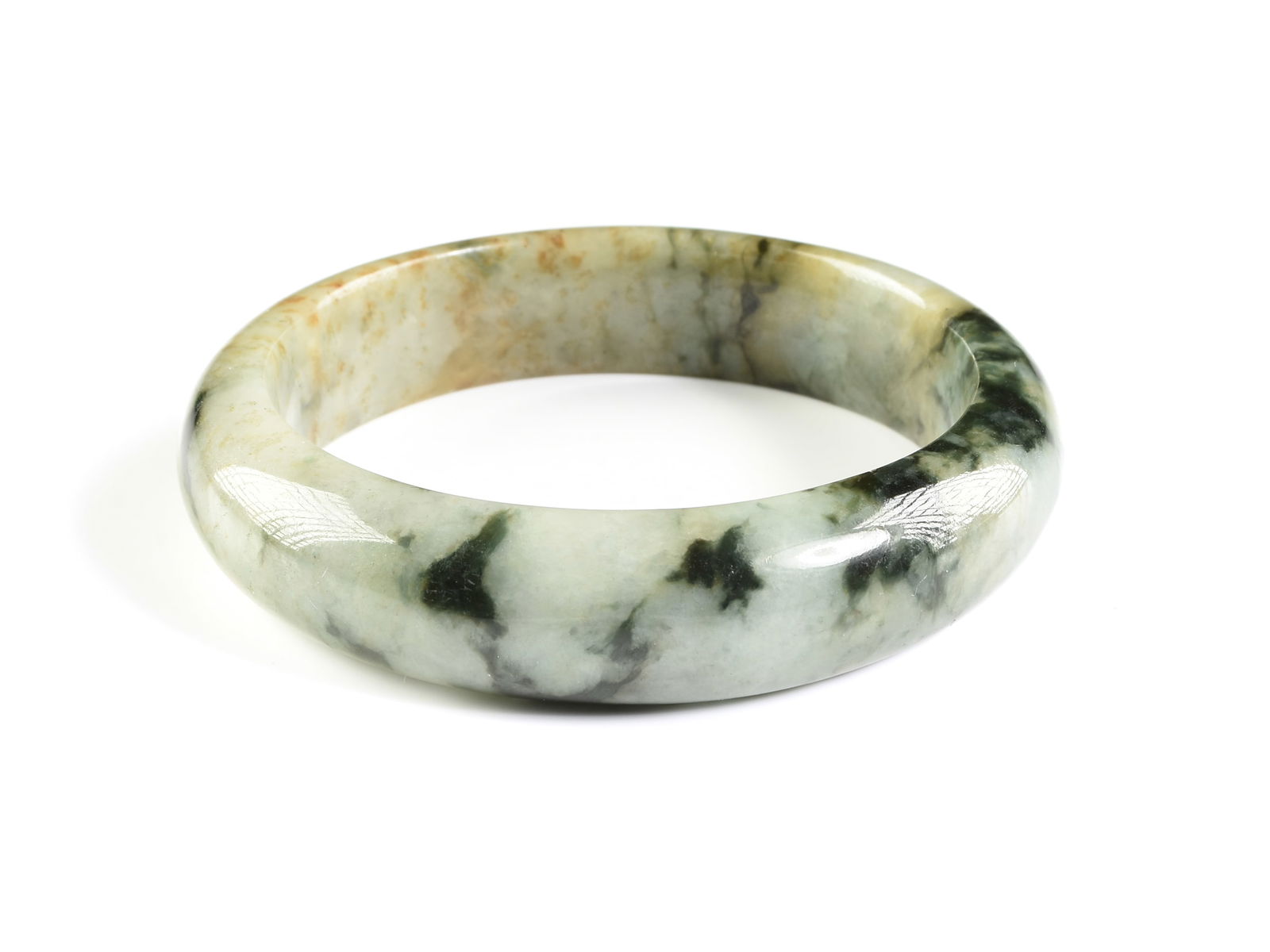 A CHINESE JADE "MOSS IN THE SNOW" BANGLE BRACELET WITH RUSSET INCLUSIONS, MID 20TH CENTURY (1 of 1)