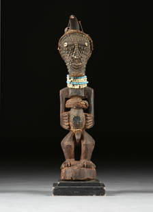 AN AFRICAN SCULPTURE, "COMMUNITY POWER" FIGURE, SONGYE, DEMOCRATIC REPUBLIC OF THE CONGO, 20TH CENTU: AN AFRICAN SCULPTURE, "COMMUNITY POWER" FIGURE, SONGYE, DEMOCRATIC REPUBLIC OF THE CONGO, 20TH CENTURY, comprised of organic material, horn, metal, shell, glass beads, cloth, leather, and wood. Height