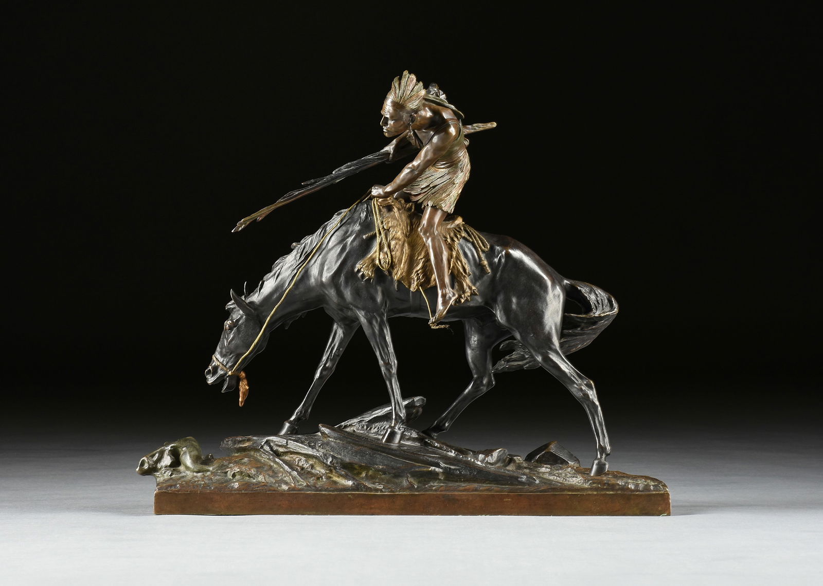 EDOUARD DROUOT (French 1859-1945) A SCULPTURE, "Indian on Horseback (on the War Path)," 1930s-1940s: EDOUARD DROUOT (French 1859-1945) A SCULPTURE, "Indian on Horseback (on the War Path)," 1930s-1940s, painted and parcel gilt cast bronze, signed in bronze on the integral base, "E. Drouot." Height: 21