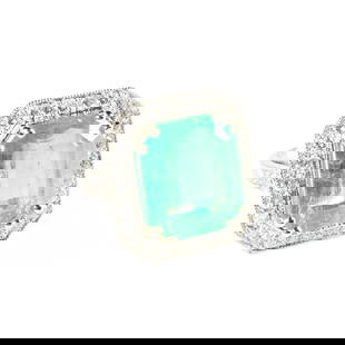 AN ART DECO PLATINUM, DIAMOND, AND COLOMBIAN EMERALD RING, EARLY/MID 20TH CENTURY: AN ART DECO PLATINUM, DIAMOND, AND COLOMBIAN EMERALD RING, EARLY/MID 20TH CENTURY, a central cushion cut Colombian emerald within an eight double prong setting measures approximately 14.98 mm x 13.03