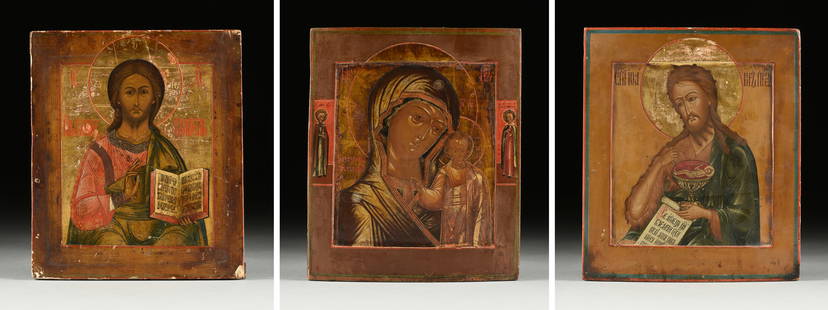 THREE RUSSIAN ICONS, A DEISIS TRIPTYCH, NORTH RUSSIA AND MOSCOW, 19TH CENTURY: THREE RUSSIAN ICONS, A DEISIS TRIPTYCH, NORTH RUSSIA AND MOSCOW, 19TH CENTURY, comprising a "Christ Pantocrator," Moscow, gilt, egg tempera, and gesso on wood, 14" x 12"; "Mother of God of Kazan," Nor