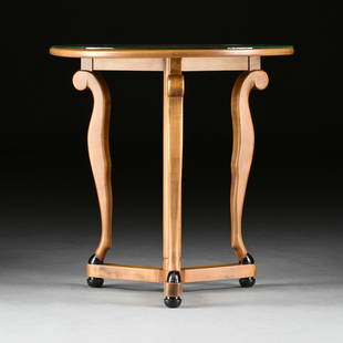 AN AMERICAN ART DECO PERIOD BIEDERMEIER REVIVAL EBONIZED MAPLE SIDE TABLE, ROBERT W. IRWIN, GRAND RA: AN AMERICAN ART DECO PERIOD BIEDERMEIER REVIVAL EBONIZED MAPLE SIDE TABLE, ROBERT W. IRWIN, GRAND RAPIDS, 1934, the circular top is supported by three restrained cabriole legs ending with black lacque