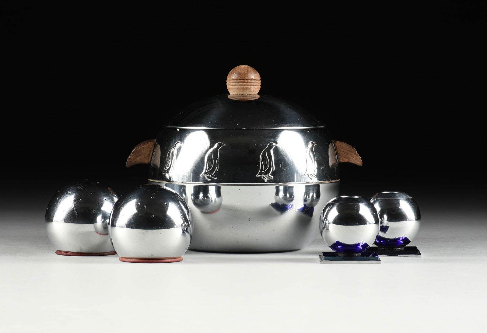 FIVE PIECES OF CHROME-PLATED TABLEWARE, RUSSEL WRIGHT FOR CHASE AND WEST BEND PENGUIN, AMERICAN, 193: FIVE PIECES OF CHROME-PLATED TABLEWARE, RUSSEL WRIGHT FOR CHASE AND WEST BEND PENGUIN, AMERICAN, 1930s-1940s, comprising a "Penguin" hot/cold covered serving dish/ice bucket with relief penguins and w