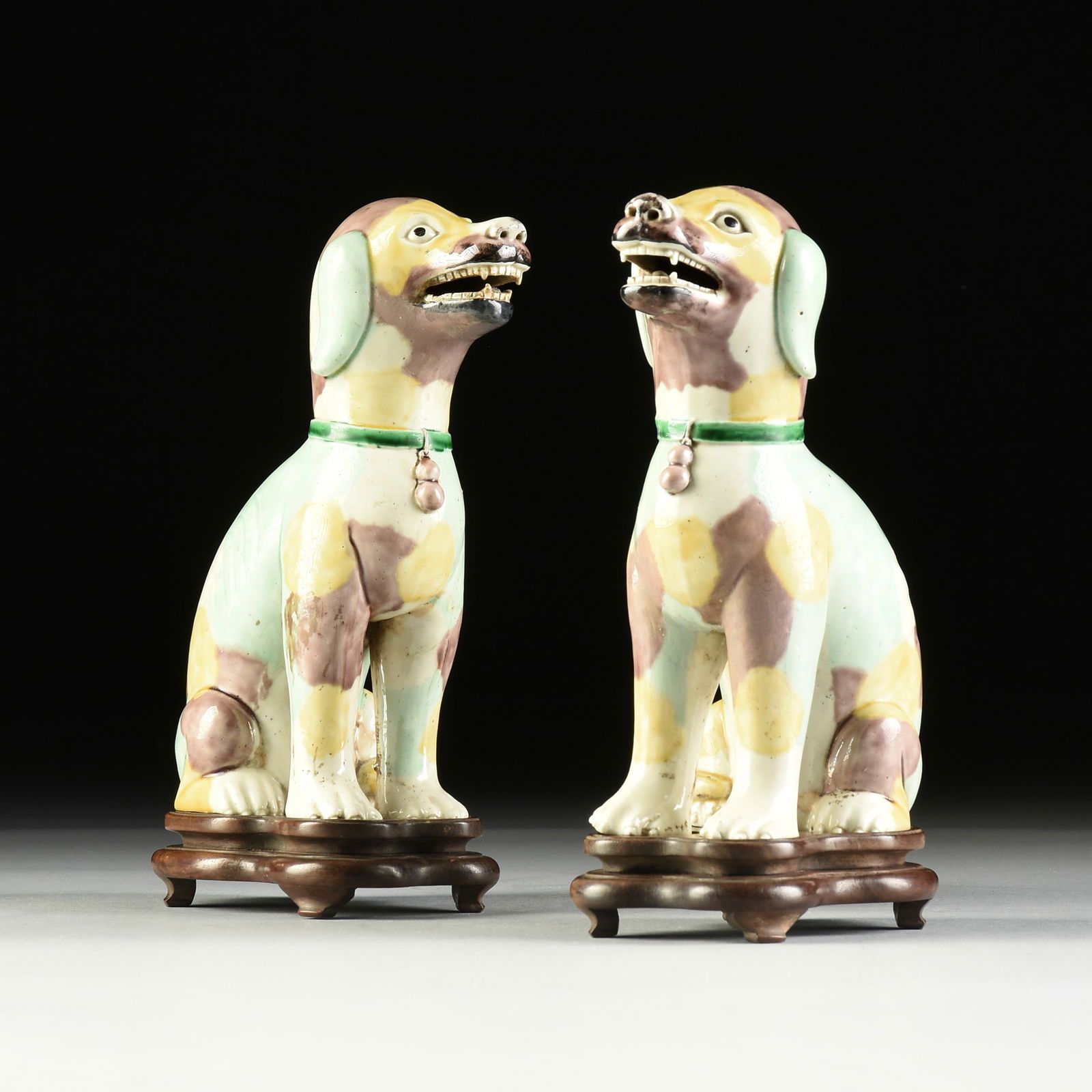 A PAIR OF CHINESE SANCAI GLAZE EARTHENWARE SEATED HOUND DOGS ON STAND, LATE QING DYNASTY (1 of 6)