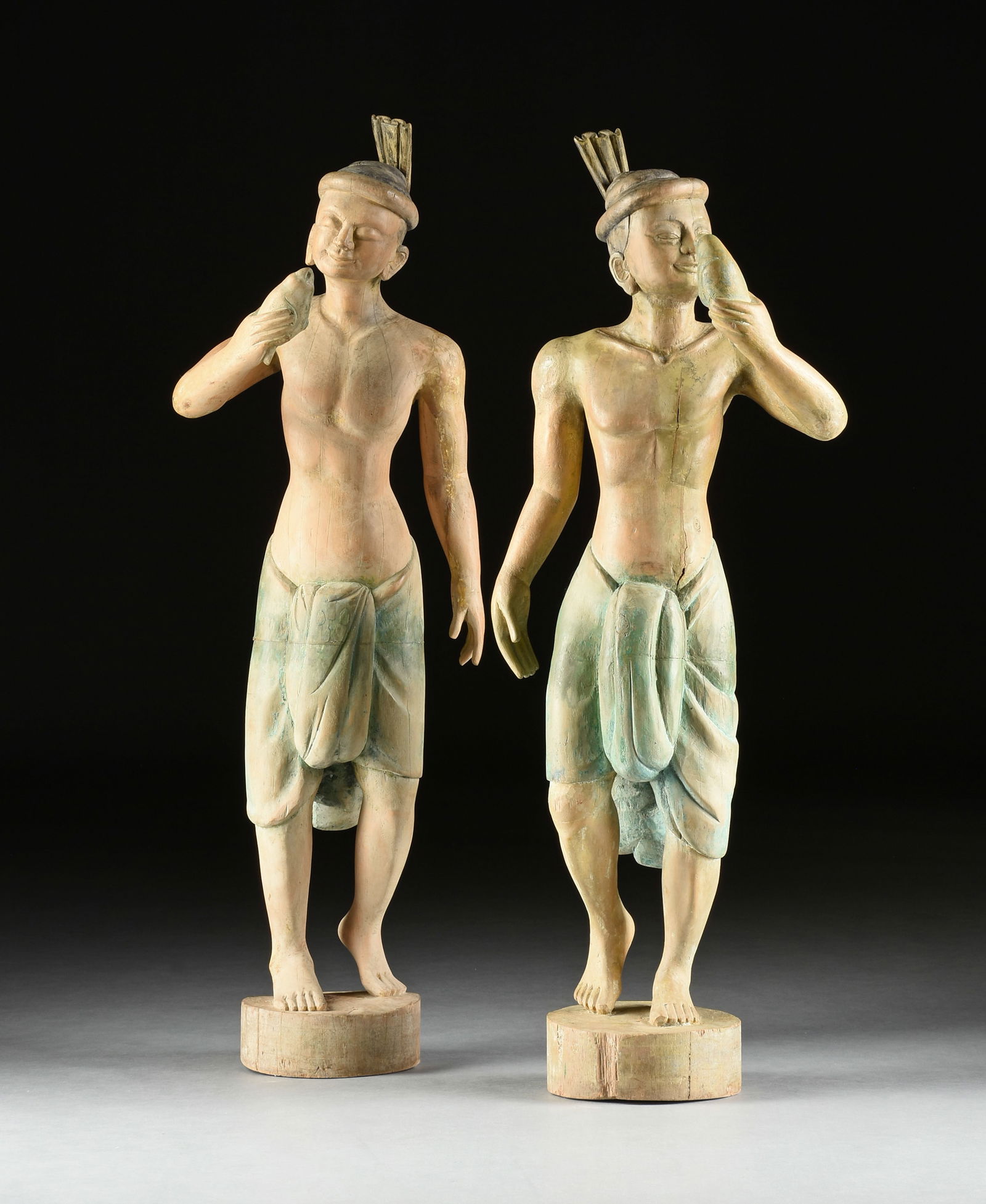 A PAIR OF SOUTHEAST ASIAN PAINTED WOOD STANDING FIGURES OF MAN HOLDING BIRDS, POSSIBLY MALAYSIAN, (1 of 18)