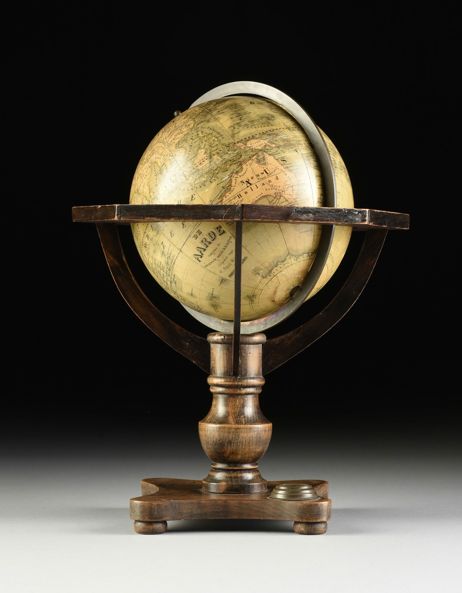 CARL ABEL-KLINGER (German 19th Century) A TERRESTRIAL GLOBE, CIRCA 1855,: CARL ABEL-KLINGER (German 19th Century) A TERRESTRIAL GLOBE, CIRCA 1855, with twelve colored paper segments and two polar calottes over a plaster ball, contained in a wooden frame with octagonal horiz