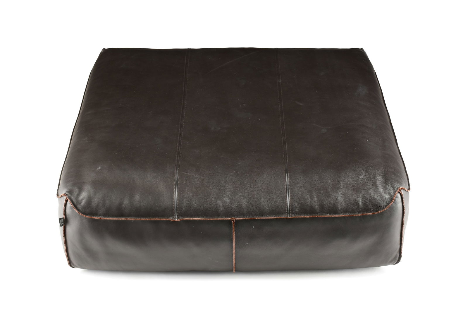 A ROLF BENZ 950 ESPRESSO LEATHER FLOOR SEATING CUSHION, GERMAN, MODERN,: A ROLF BENZ 950 ESPRESSO LEATHER FLOOR SEATING CUSHION, GERMAN, MODERN, of rectangular form with special stitching, labeled at the side, and with an anti-slip foot. Height: 10 1/2" Width: 37" Depth: 3