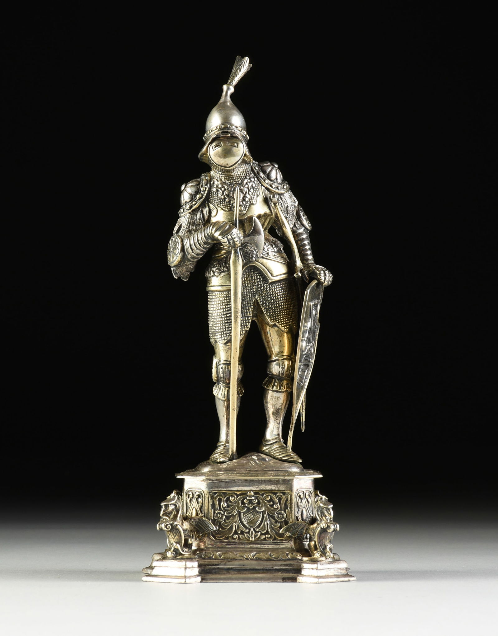 A WILHELM II STERLING SILVER, GOLD GILT WASH, AND BONE RENAISSANCE STYLE KNIGHT, GERMAN, LATE 19TH: A WILHELM II STERLING SILVER, GOLD GILT WASH, AND BONE RENAISSANCE STYLE KNIGHT, GERMAN, LATE 19TH CENTURY, sterling silver with gold gilt wash details, the feather-plumed conical helmet with flipping