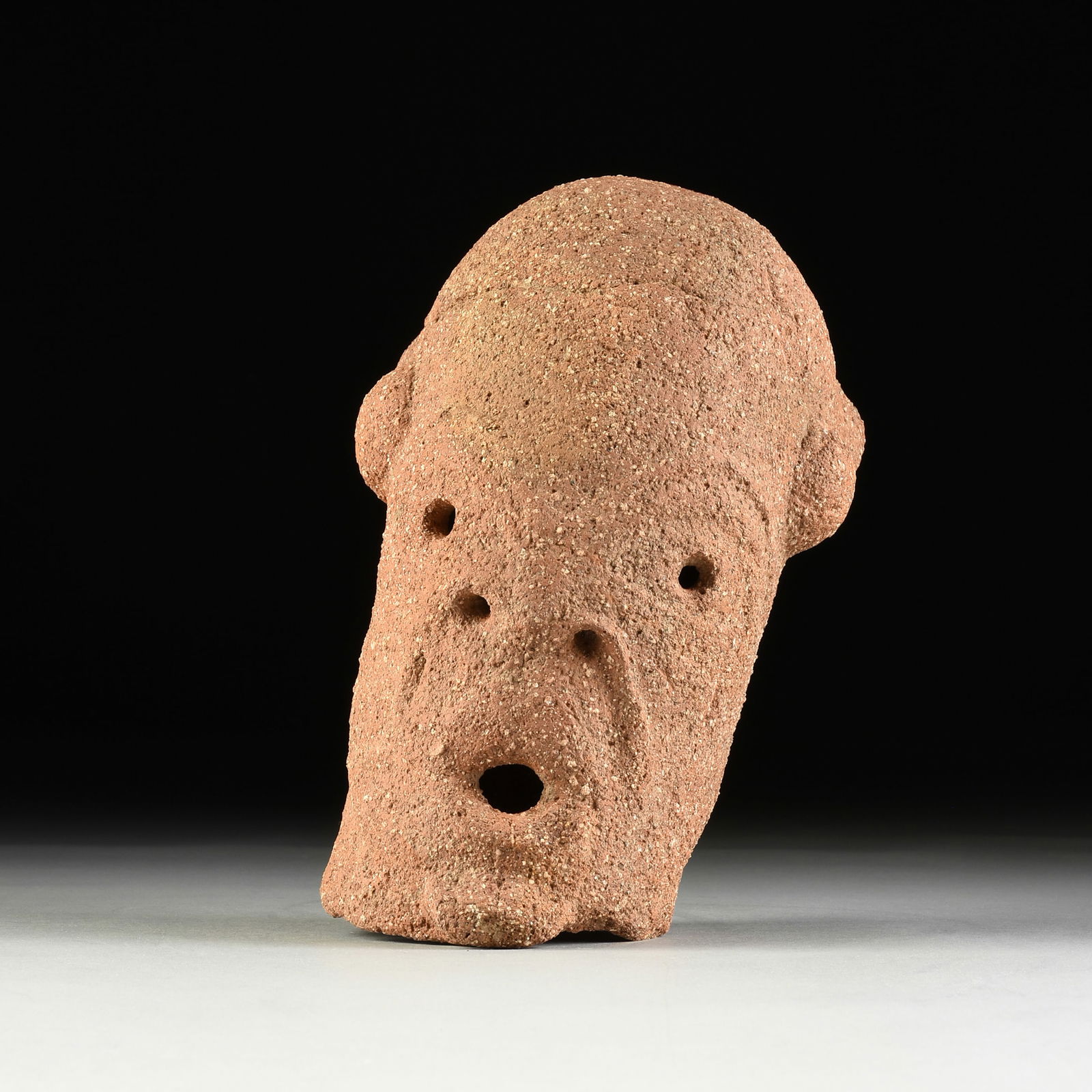 AN ANCIENT AFRICAN IRON AGE TERRACOTTA LARGE HEAD OF MAN, NOK CULTURE, NIGERIA, APPROXIMATELY 500 (1 of 4)