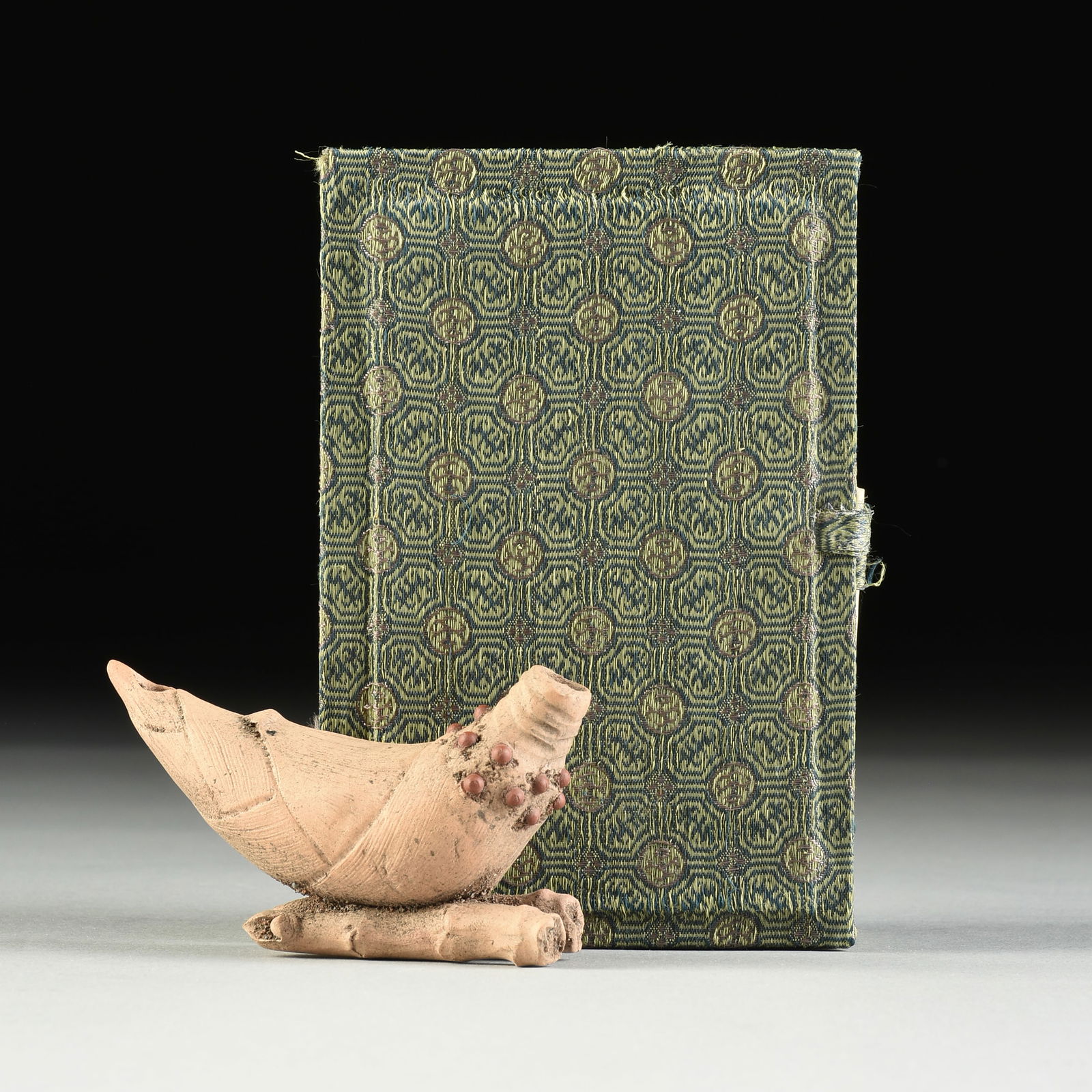 A YIXING POTTERY WATER DROPPER, BAMBOO SHOOT FORM, ATTRIBUTED TO ZHOU DINGFANG (b. 1965), CHINESE,: A YIXING POTTERY WATER DROPPER, BAMBOO SHOOT FORM, ATTRIBUTED TO ZHOU DINGFANG (b. 1965), CHINESE, LATE 20TH CENTURY, clay modeled as a tightly closed bamboo shoot tip with red nodules and with holes