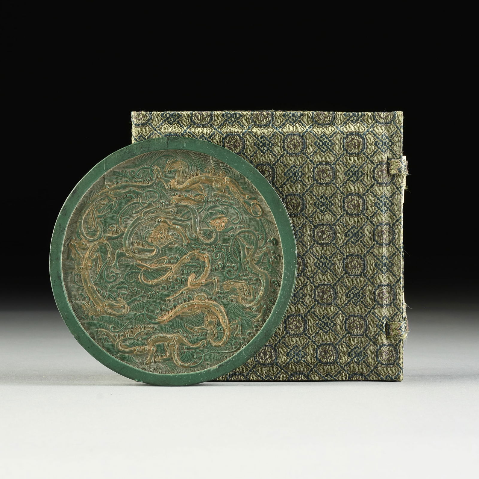 A MING DYNASTY STYLE GREEN INK CAKE, HAIRY DRAGONS AND CALLIGRAPHY, QING DYNASTY (1644-1912), 19TH (1 of 3)