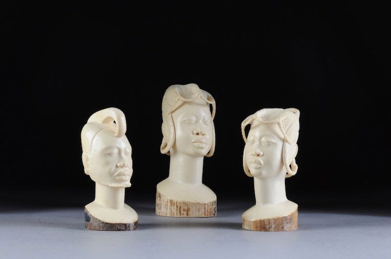 A GROUP OF THREE AFRICAN CARVED IVORY BUSTS OF NATI: A GROUP OF THREE AFRICAN CARVED IVORY BUSTS OF NATIVES, 20TH CENTURY, each having nicely detailed facial features and depicting two maiden natives with elaborately modeled hairstyles and one native be