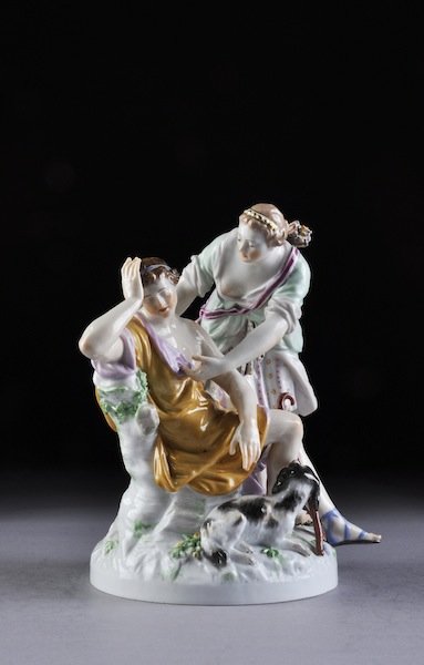 A BERLIN POLYCHROME PAINTED PORCELAIN FIGURAL GROU: A BERLIN POLYCHROME PAINTED PORCELAIN FIGURAL GROUP, LUNA U ENDYIMON, UNDERGLAZE BLUE SCEPTER MARK, LATE 19TH/EARLY 20TH CENTURY, modeled as Diana the Huntress waking a sleeping youth with his compani