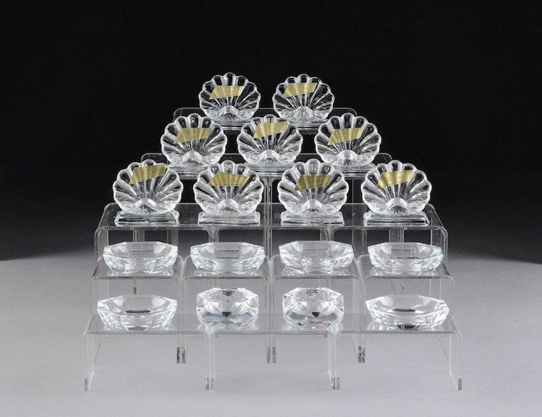 A GROUP OF SEVENTEEN BACCARAT LEADED CRYSTAL DINNE: A GROUP OF SEVENTEEN BACCARAT LEADED CRYSTAL DINNER TABLE ACCESSORIES, MODERN, each set boxed and having the circular maker's mark on underside and comprising; a set of 9 shell form place card stands,