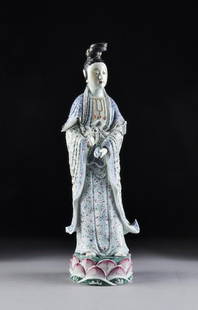 A CHINESE FAMILLE ROSE PORCELAIN FIGURE OF GUANYIN: A CHINESE FAMILLE ROSE PORCELAIN FIGURE OF GUANYIN, SIGNED, POSSIBLY REPUBLIC PERIOD, EARLY 20TH CENTURY, modeled in a standing position and wearing an elaborate chignon hairstyle above a smiling