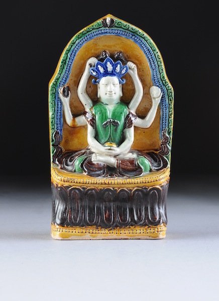A RARE 15TH CENTURY CHINESE STONEWARE TEMPLE ICON : A RARE 15TH CENTURY CHINESE STONEWARE TEMPLE ICON MOLDED AS THE GOD VISHNU, with multi enameled glaze. Bearing the seal Hsuan Te (1426-1435). NOTE: Similar to plate XXlll in Thiels Chinese pottery and
