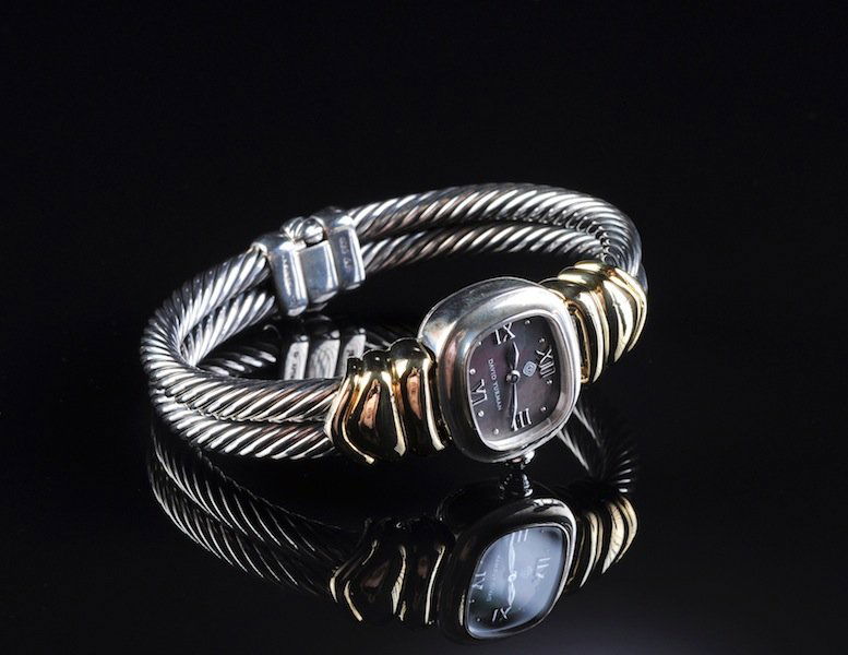 A 14K YELLOW GOLD, AND STERLING DAVID YURMAN CHELS: A 14K YELLOW GOLD, AND STERLING DAVID YURMAN CHELSEA DOUBLE CABLE LADY'S WATCH, the two tone band signed 'David Yurman,' with gray Mother of Pearl dial. Swiss made. Excellent time keeping accuracy wit