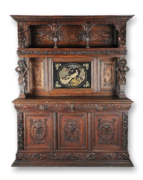 A RENAISSANCE REVIVAL CARVED OAK BUFFET À DEUX COR: A RENAISSANCE REVIVAL CARVED OAK BUFFET À DEUX CORPS, LATE 19TH/EARLY 20TH CENTURY, the leaf tip detailed molded cornice above a triple arched gallery with blossoming foliage back panels raised on be