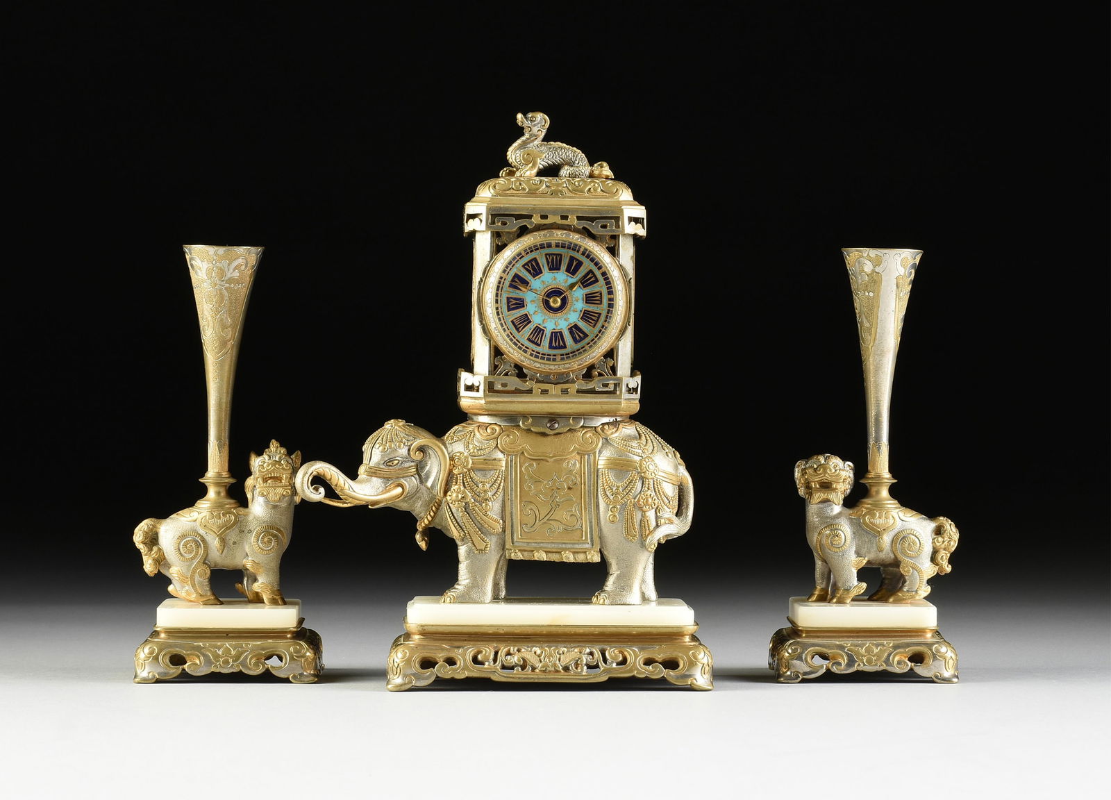A THREE-PIECE FRENCH ORIENTALIST GILT AND SILVERED BRONZE ELEPHANT CLOCK WITH GARNITURE, FOR TURKISH (1 of 17)