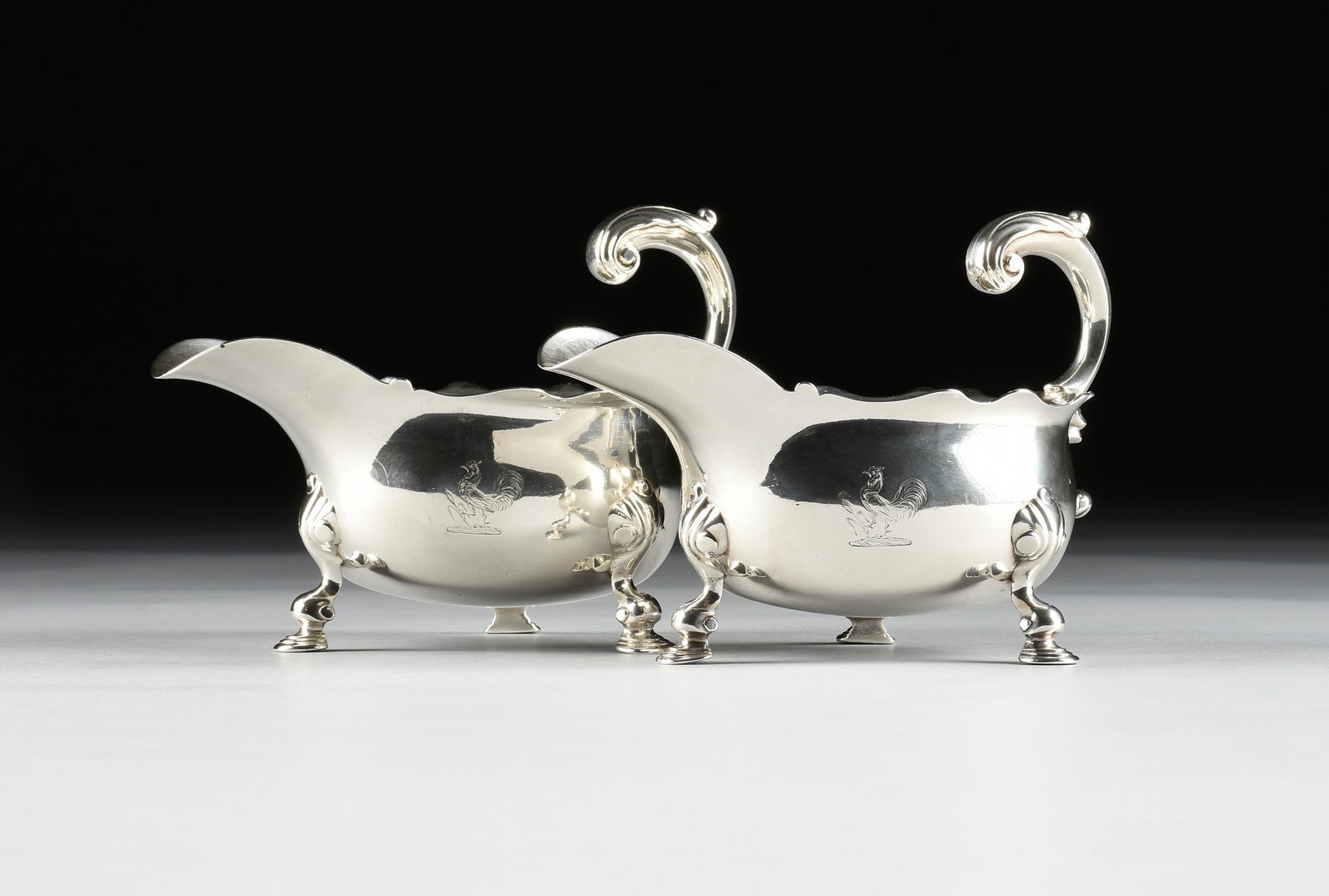 A PAIR OF GEORGE II BAROQUE STERLING SILVER SAUCE BOATS, MARK OF HUMPHREY PAYNE, ARMORIAL CREST (1 of 8)
