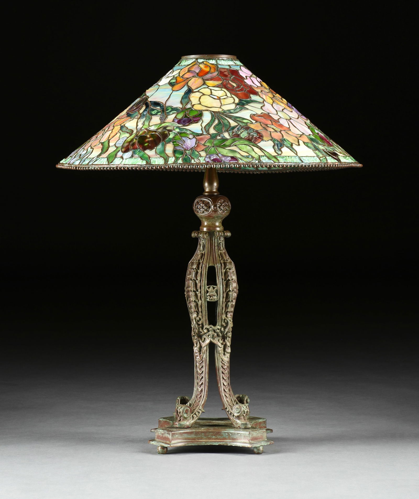 A TIFFANY STYLE "PEONY" STAINED GLASS SHADE ON FOUR-LIGHT BRONZE BASE, MID/LATE 20TH CENTURY (1 of 9)