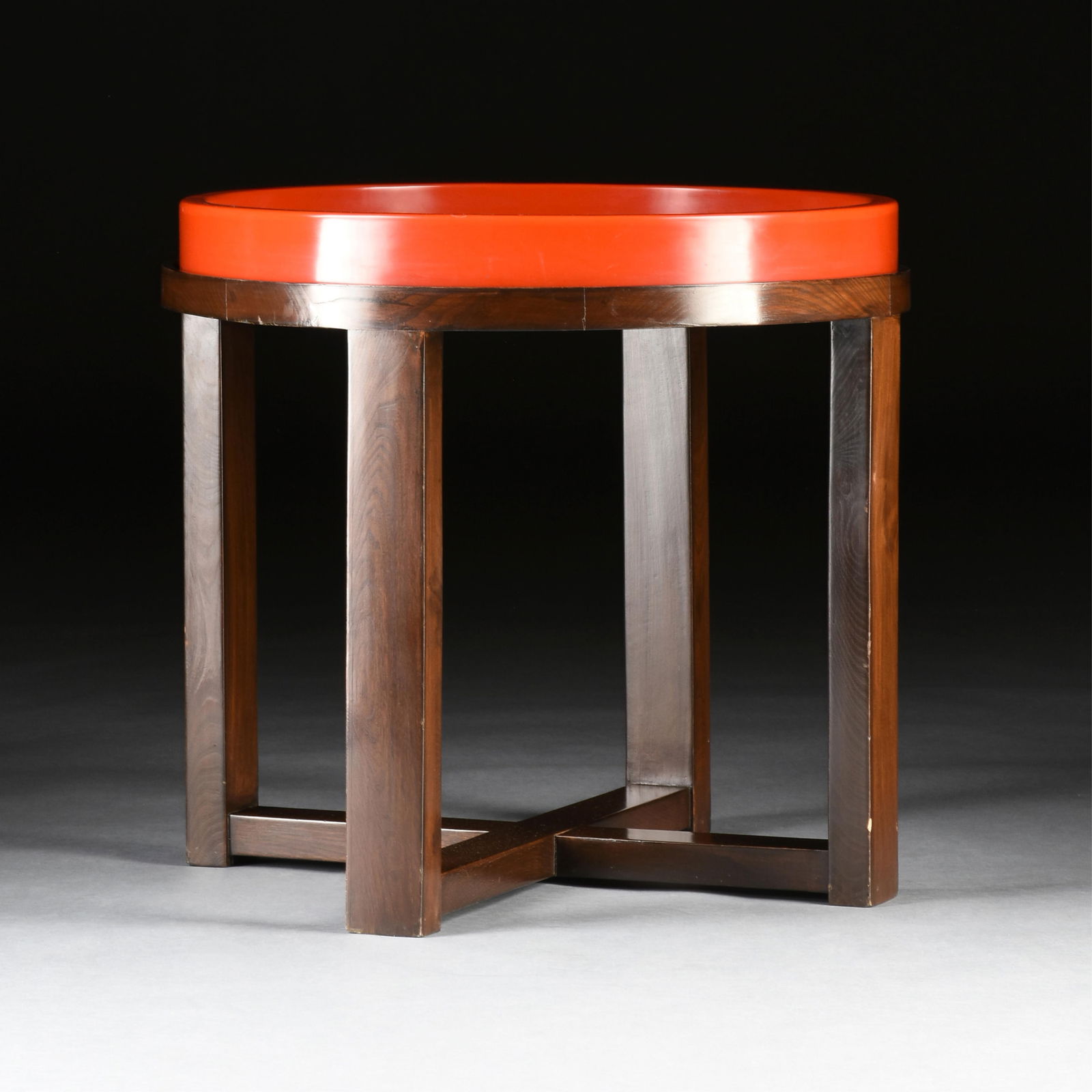 A MCGUIRE ROUND MODERN SIDE TABLE WITH RED TOP, AMERICAN, 20TH CENTURY, an X-form wooden side table (1 of 5)