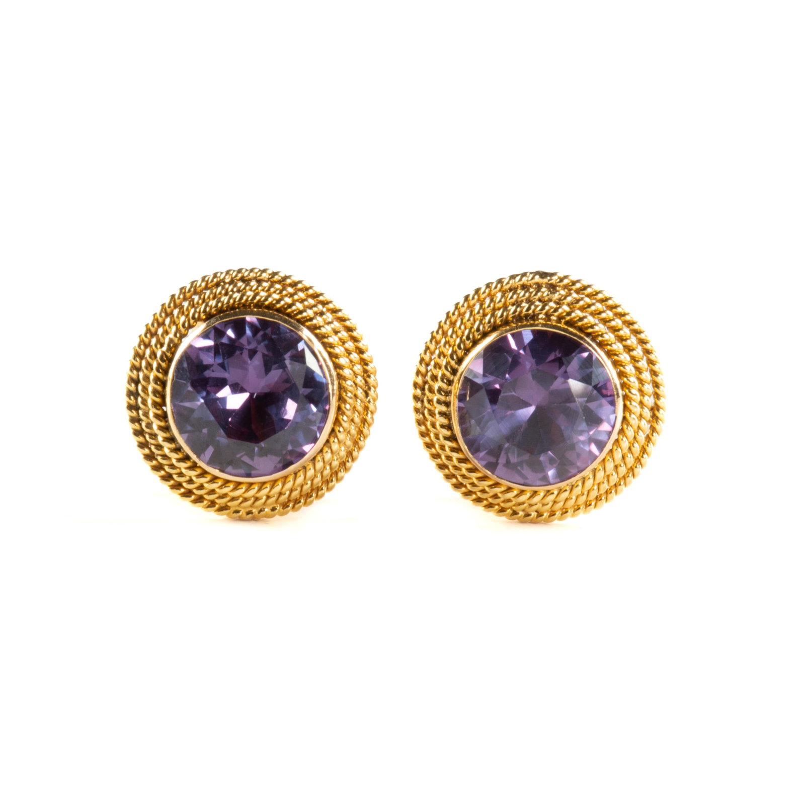A PAIR OF 14K YELLOW GOLD AND COLOR CHANGE SAPPHIRE EARRINGS, CIRCA 1990, a pair of 14K yellow gold: A PAIR OF 14K YELLOW GOLD AND COLOR CHANGE SAPPHIRE EARRINGS, CIRCA 1990, a pair of 14K yellow gold earrings with omega clip backs set with round synthetic sapphires measuring 12 mm, marked "14K." Tot